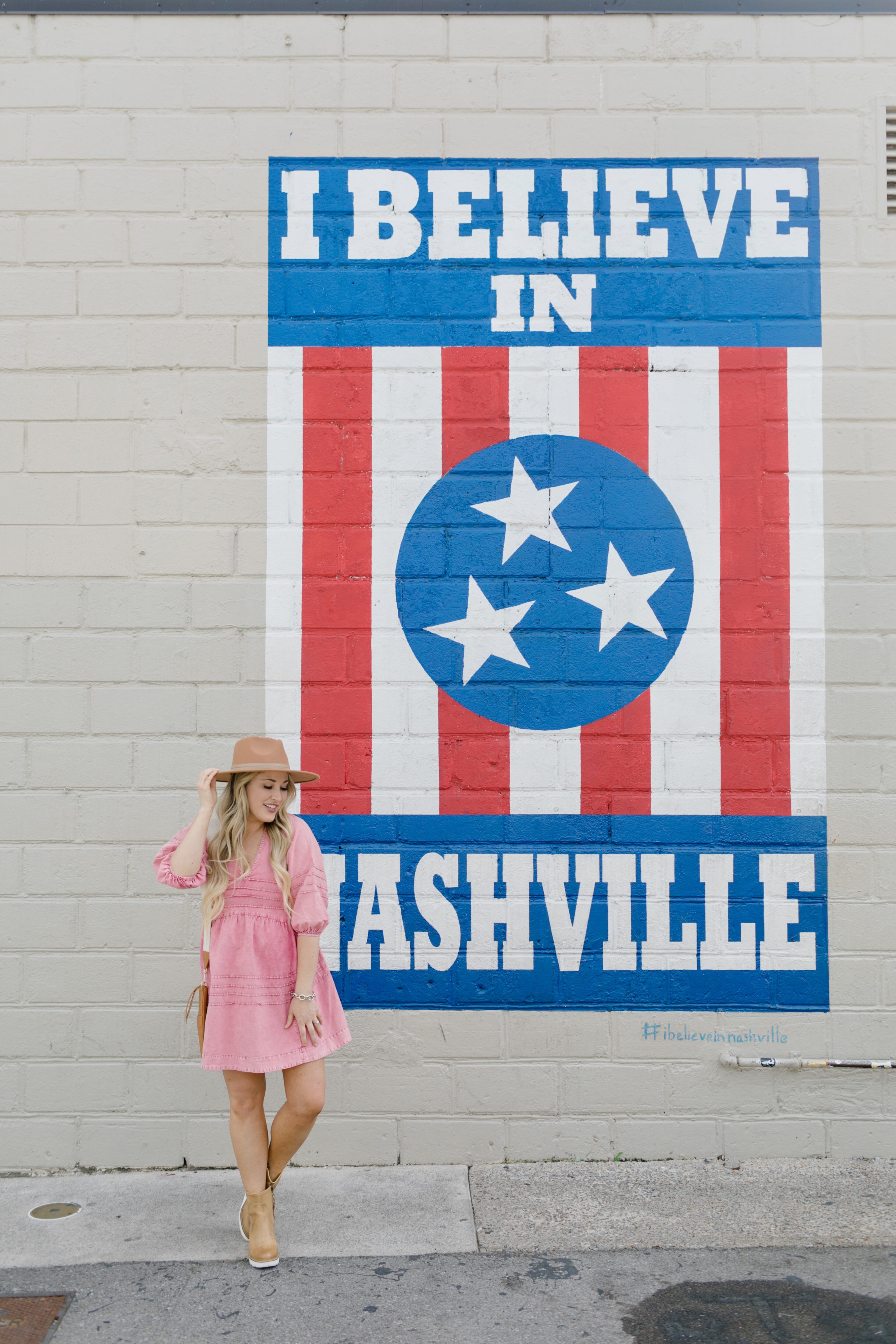 country music concert outfit: western hat, midi dress, cowboy boots